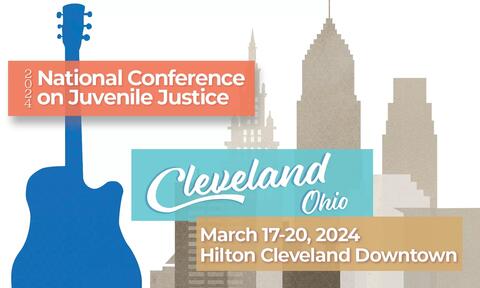 Conference banner with guitar and Cleveland skyline icons
