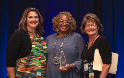 Accepting the award were Kelley Heifort, Community Reentry Director, MN Department of Corrections;  Lee Buckley, Coordinator, Community Reentry MN Department of Corrections; and Raeone Magnuson, Executive Director, Office of Justice Programs MN Department of Public Safety